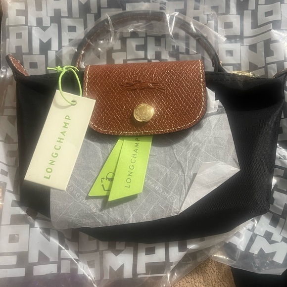 Longchamp Handbags - Longchamp Black Mini pouch with Brown Flap